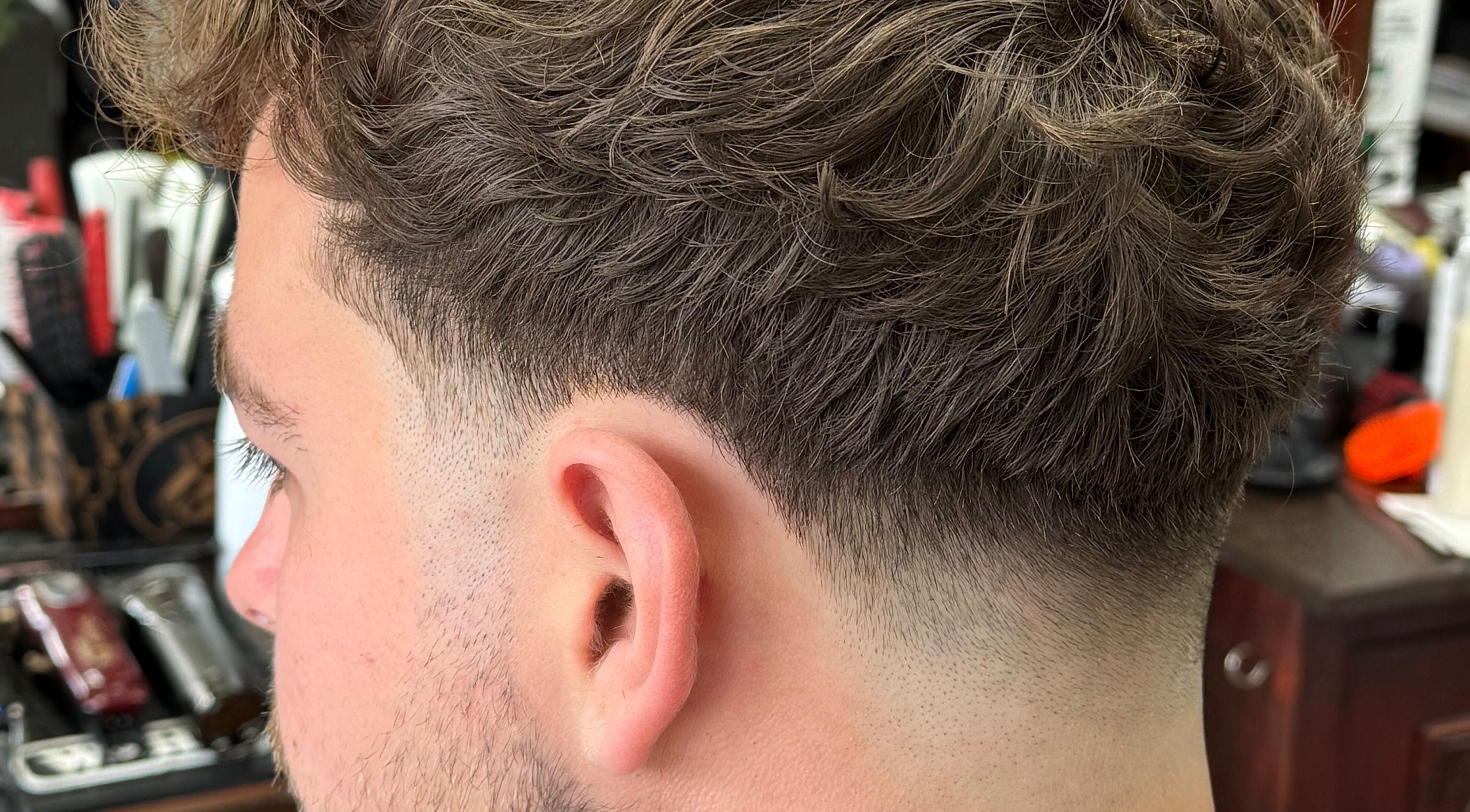 Close-up of a stylish men's fade haircut at Andi.hair.hustler, Birkenhead, England, GB.