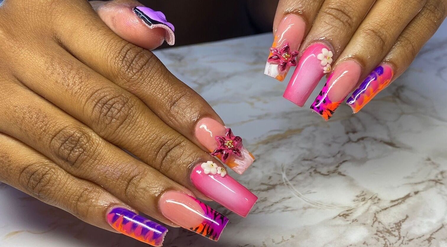 Colorful nail art at Ccallicosmetics in Speightstown, Saint Peter, BB, showcasing intricate designs and decorations.