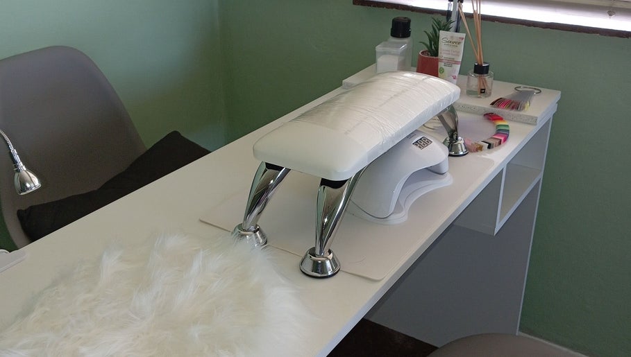 Nail service desk with tools at Lashed_byRosy in Cape Town, ZA, offering a serene setting.