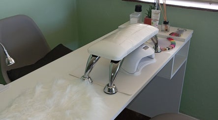 Nail service desk with tools at Lashed_byRosy in Cape Town, ZA, offering a serene setting.