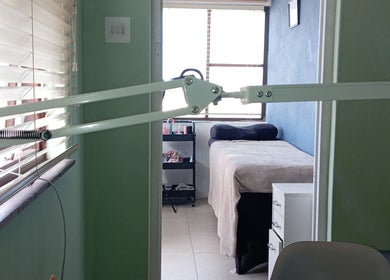 Relaxing lash treatment room at Lashed_byRosy in Cape Town, ZA, featuring a comfortable bed and serene ambiance.