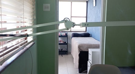 Relaxing lash treatment room at Lashed_byRosy in Cape Town, ZA, featuring a comfortable bed and serene ambiance.