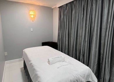 Massage room at No.1 Nassau Spa, Syosset, New York, US with soft lighting and elegant decor.