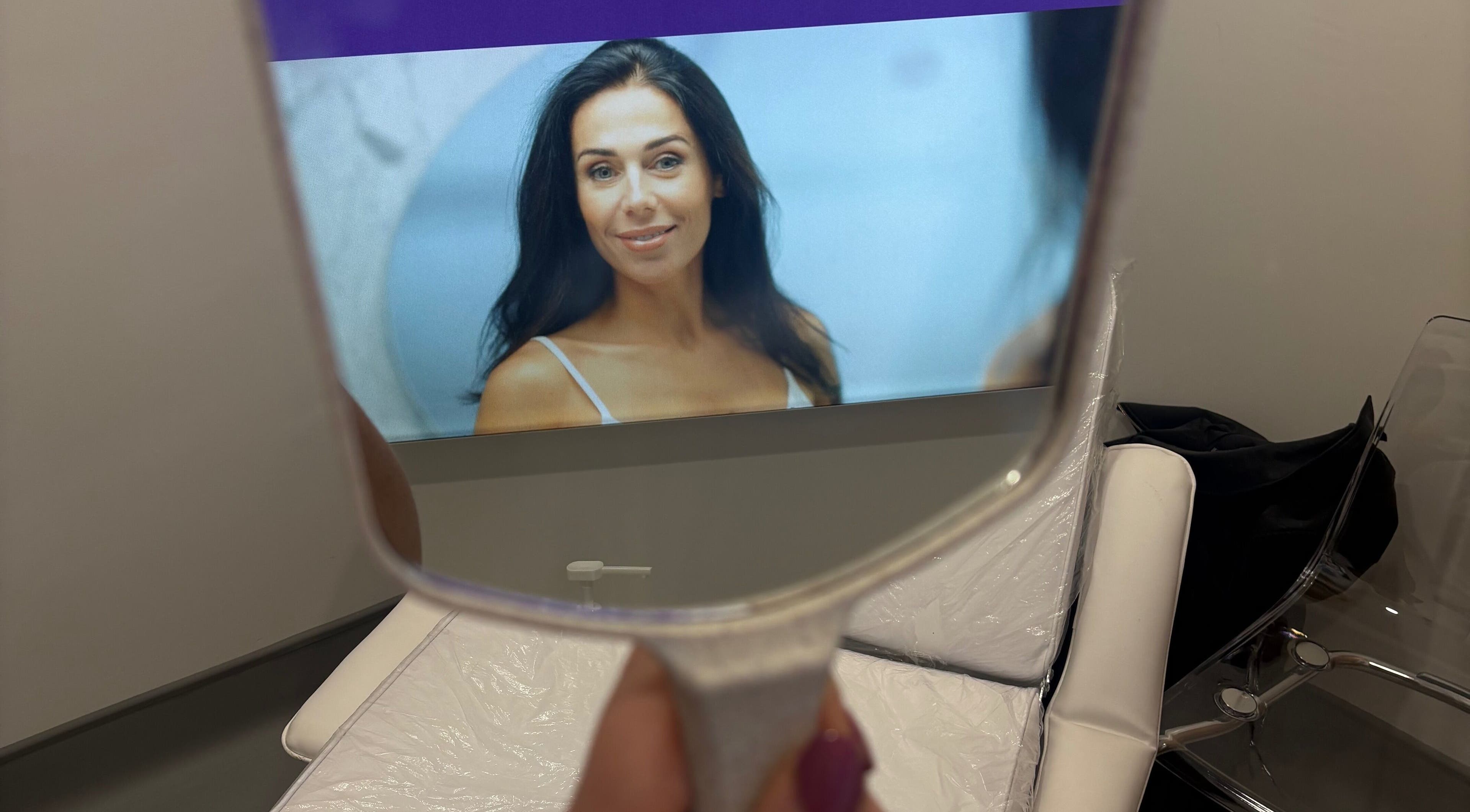 Reflection of a woman in beauty treatment room at Ashthetics, Barrhead, Scotland, GB.