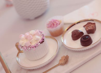 Elegant dessert setup with chocolates and cupcake at Glow Up Beauty Studio, Dublin, County Dublin, IE.