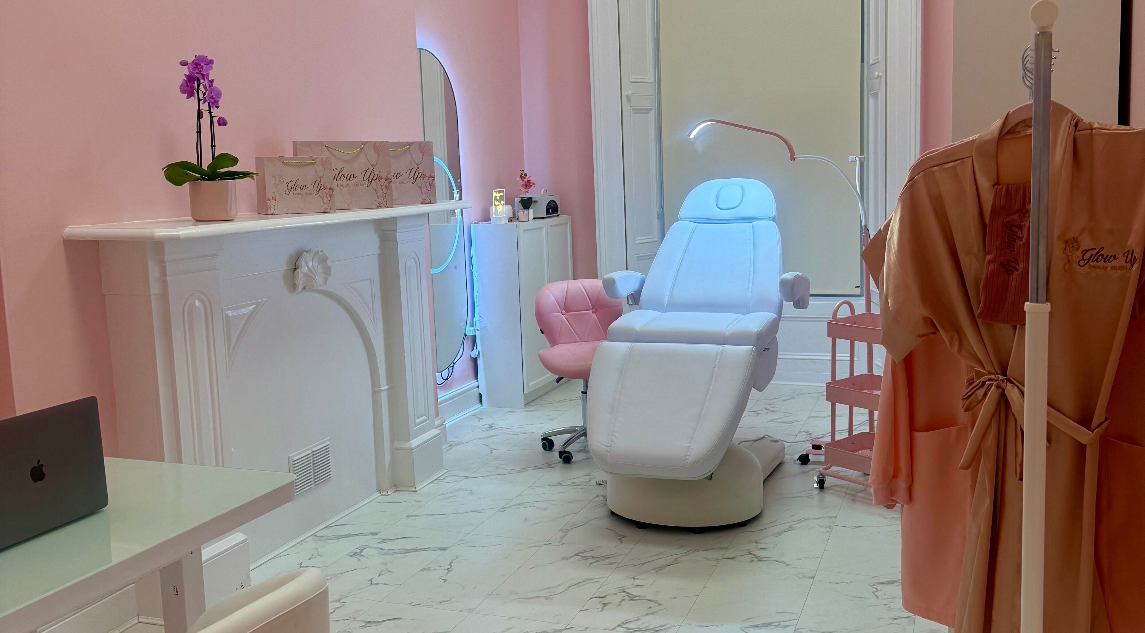 Elegant treatment room at Glow Up Beauty Studio, Dublin, County Dublin, IE, featuring plush chair and ambient decor.