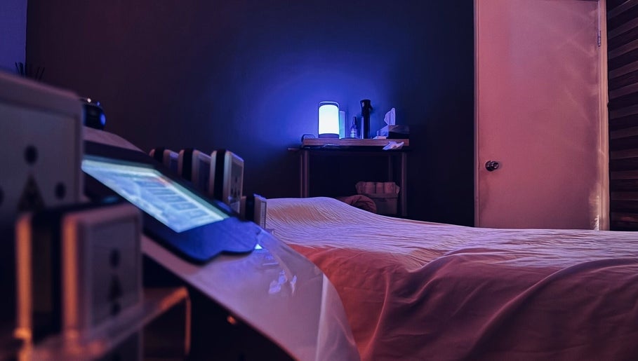 Relaxing massage room at Bahia Wellness Curaçao in Willemstad, Curaçao, CW with calming blue light ambiance.