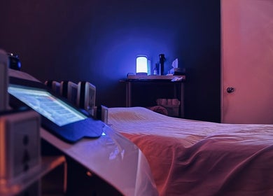 Relaxing massage room at Bahia Wellness Curaçao in Willemstad, Curaçao, CW with calming blue light ambiance.