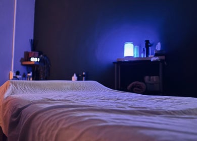 Relaxing massage room at Bahia Wellness Curaçao, Willemstad, Curaçao, CW with ambient lighting and cozy bed.