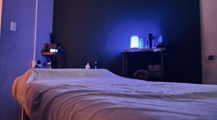 Relaxing massage room at Bahia Wellness Curaçao, Willemstad, Curaçao, CW with ambient lighting and cozy bed.