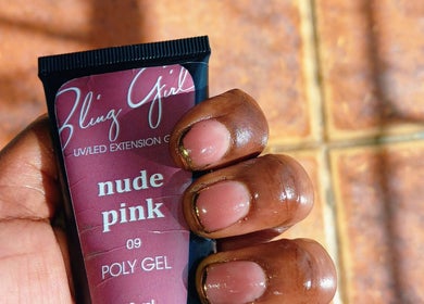 Close-up of hand holding nude pink poly gel at Leko Nails, Midrand, Gauteng, ZA.