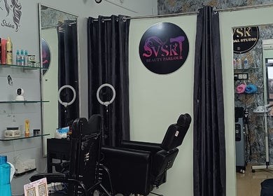 VSK Beauty Parlour's chic interior in Puducherry, IN, featuring modern styling chairs and beauty products.