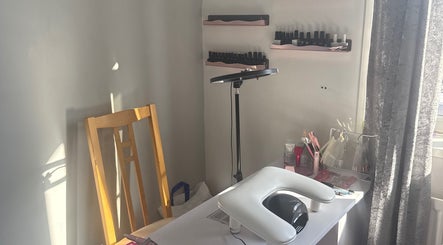 Nail workspace at Nails by MG in Howden-le-wear, England, GB, showcasing tools and polish on shelves.