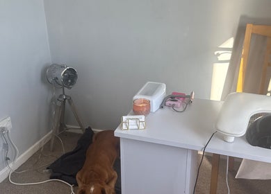 A cozy nail station at Nails by MG in Howden-le-wear, England, GB with nail tools and a lamp.