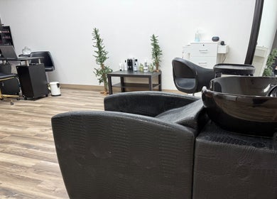 Interior of The B.A. Beauty Co. in Rifle, Colorado, US, showcasing a modern salon setup with chairs and beauty products.