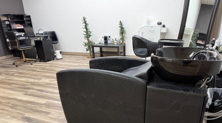 Interior of The B.A. Beauty Co. in Rifle, Colorado, US, showcasing a modern salon setup with chairs and beauty products.