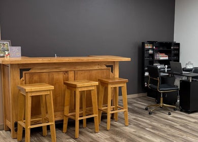 Welcoming interior of The B.A. Beauty Co. in Rifle, Colorado, US, featuring a wooden bar and seating.