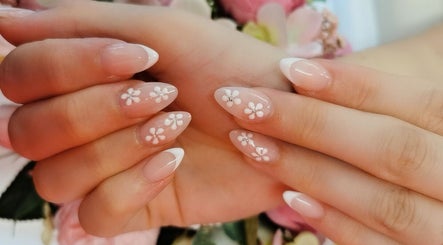 Elegant floral nail art at Princess Nails Swansea, Swansea, Wales, GB, showcasing intricate white flower designs.