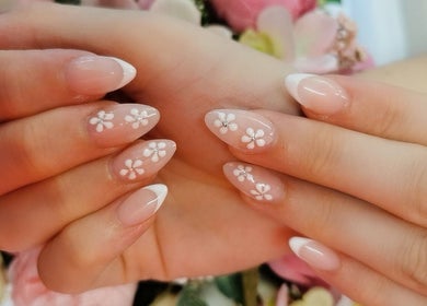 Elegant floral nail art at Princess Nails Swansea, Swansea, Wales, GB featuring detailed white flower designs.