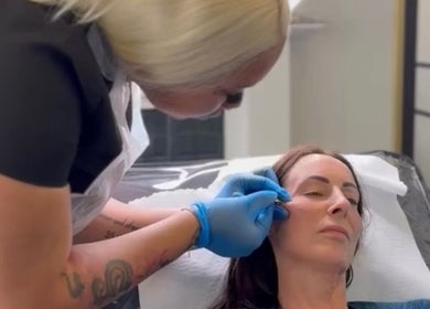 Aesthetician providing a facial treatment at Glow With Grace, Banbury, England, GB.