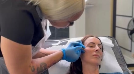 Aesthetician providing a facial treatment at Glow With Grace, Banbury, England, GB.