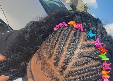 Colorful braided hairstyle with butterfly clips at IcedbyN, Fort Myers, Florida, US.