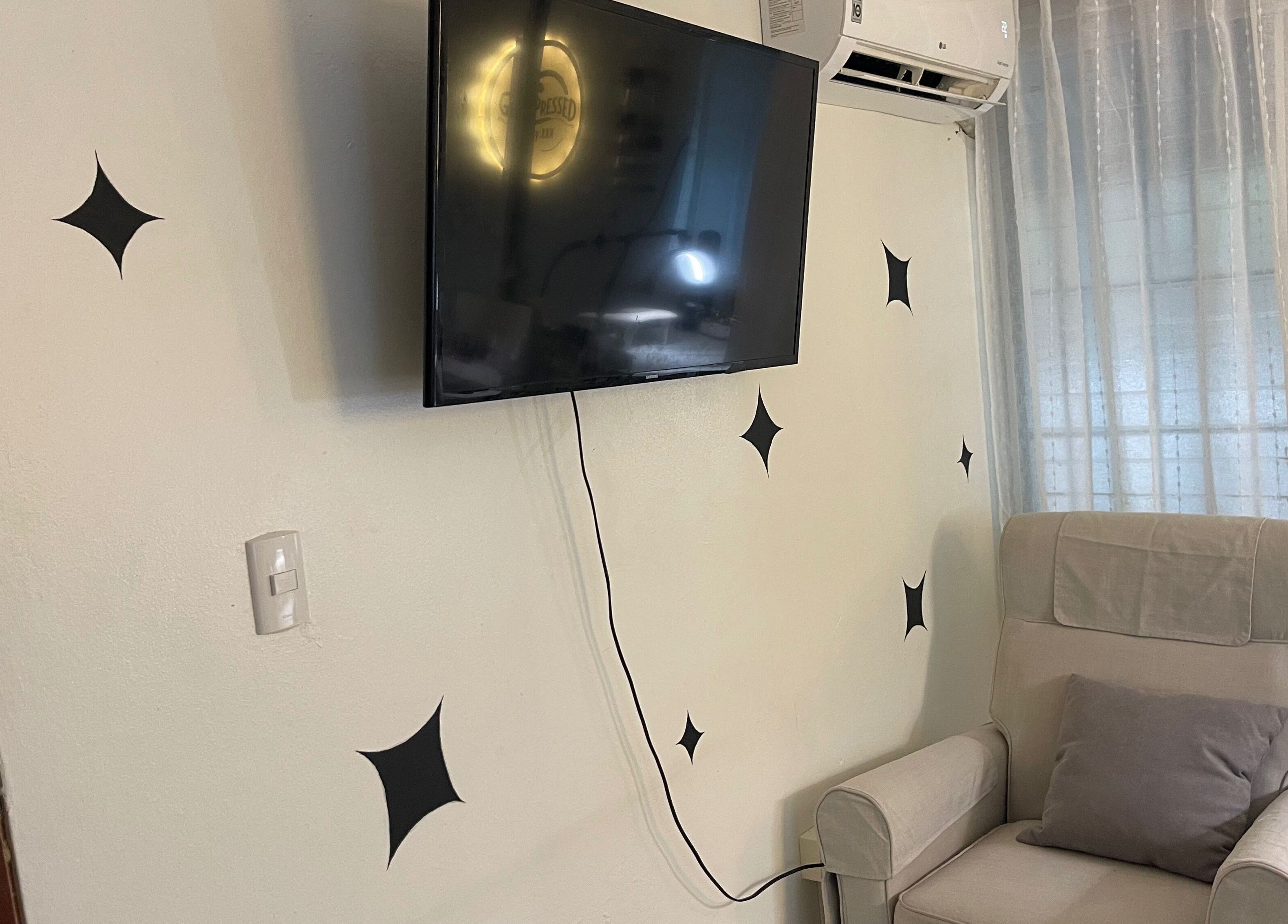 Comfortable seating and TV in the relaxing Gelpressed by Xan, Santo Domingo, Distrito Nacional, DO.