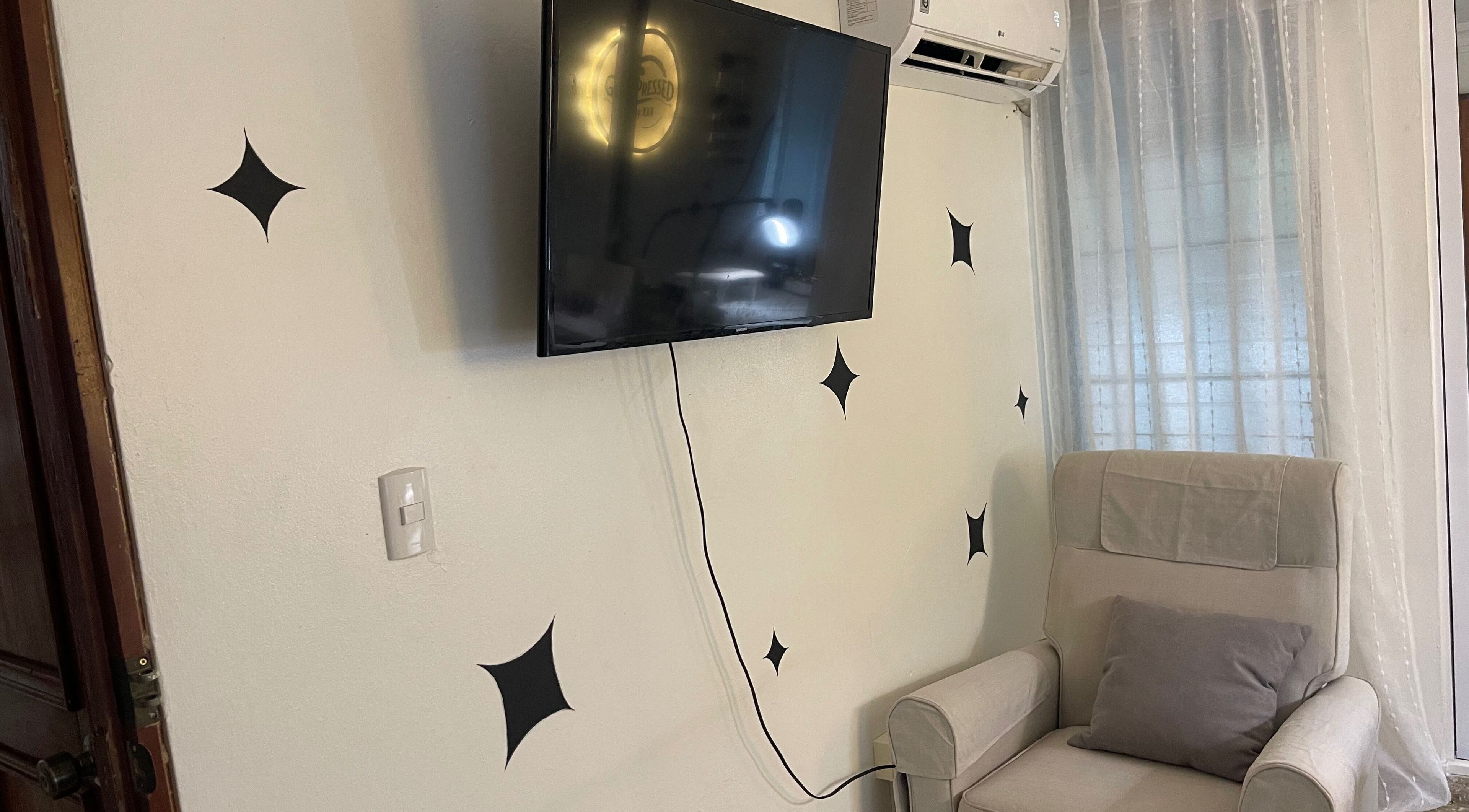 Comfortable seating and TV in the relaxing Gelpressed by Xan, Santo Domingo, Distrito Nacional, DO.