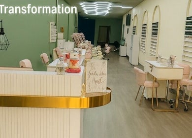 Elegant salon interior of Golden Lotus Nails, New Britain, Connecticut, US, featuring plush pink seating.