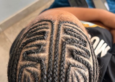 Intricate braid design at Hairbylue, Midrand, Gauteng, ZA, showcasing expert hairstyling.