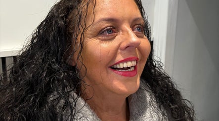 Happy client with radiant smile at Mieroi Beauty in Wigan, England, GB, showcasing expert beauty care.