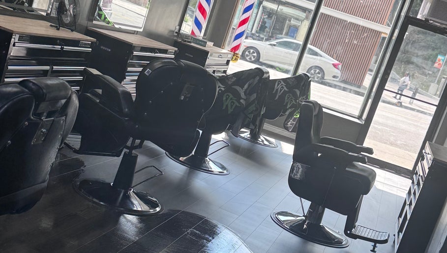 Modern barber chairs at JYSBARBER.PRO in Yonkers, New York, US, showcasing a sleek and inviting interior.