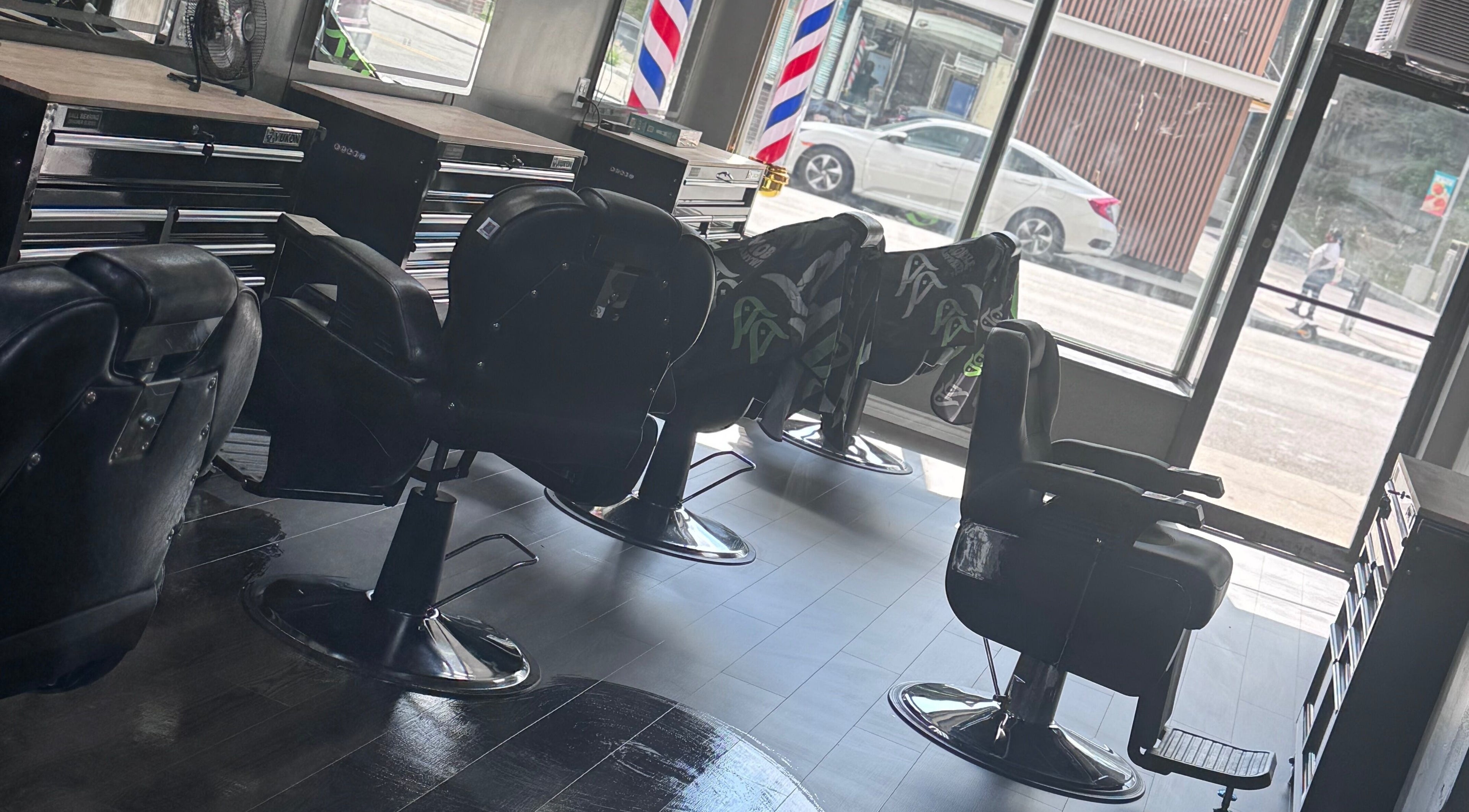 Modern barber chairs at JYSBARBER.PRO in Yonkers, New York, US, showcasing a sleek and inviting interior.