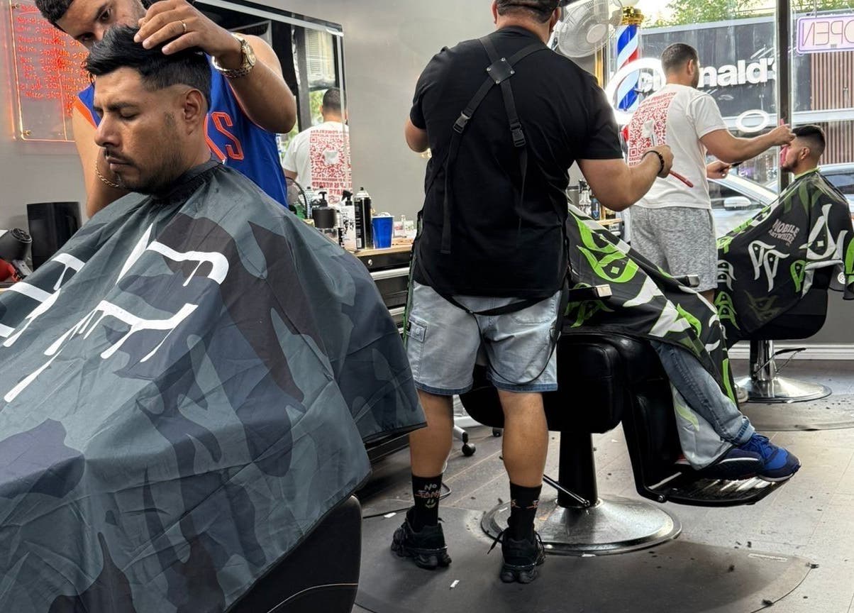 Barbers creating stylish cuts at JYSBARBER.PRO, Yonkers, New York, US.