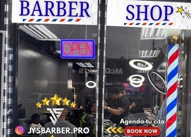 Exterior view of JYSBARBER.PRO in Yonkers, New York, US showing a bright barber shop sign.