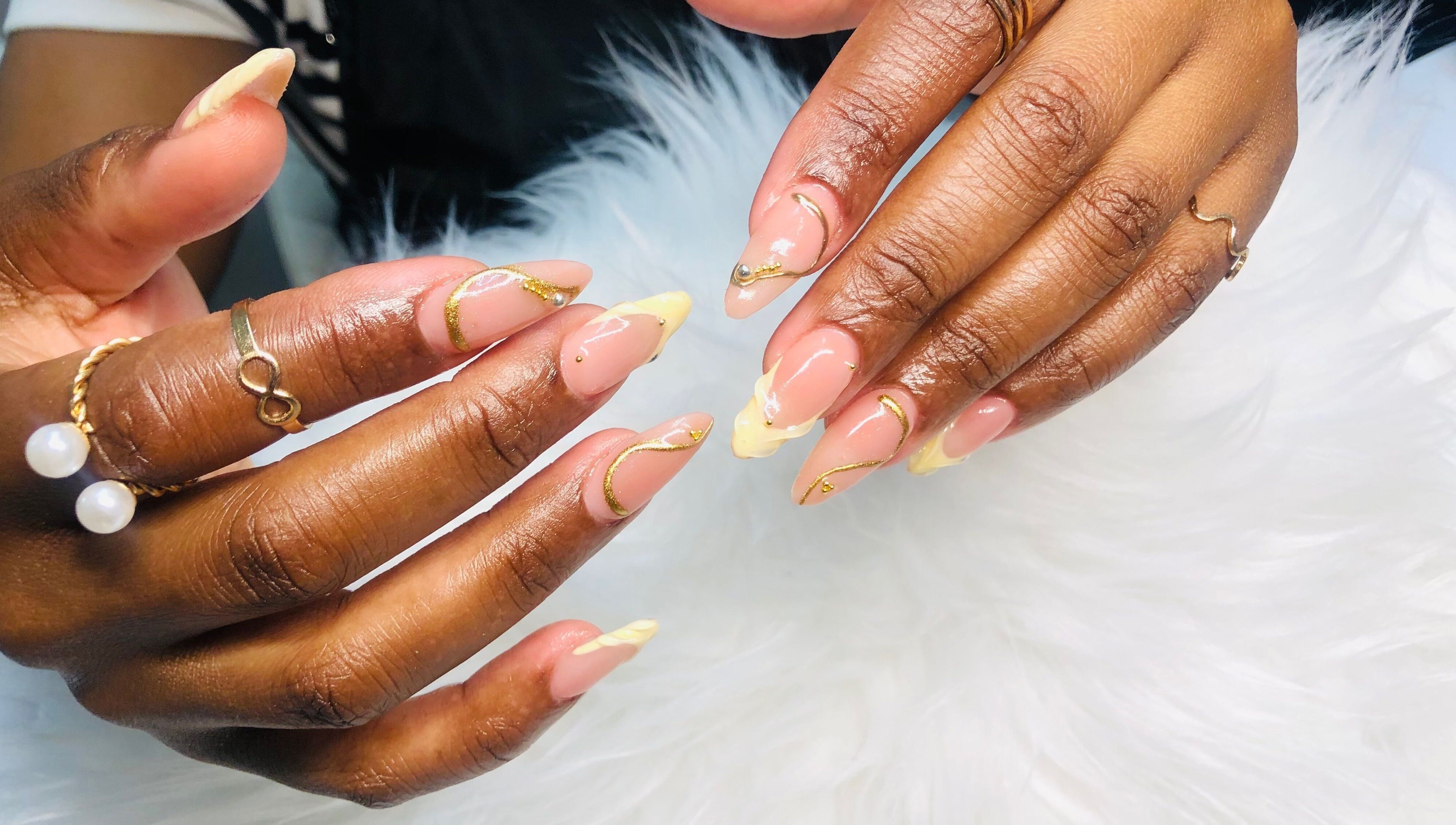 Elegant nail art with gold accents at Nailed by Mandy, Katlehong, Gauteng, ZA.
