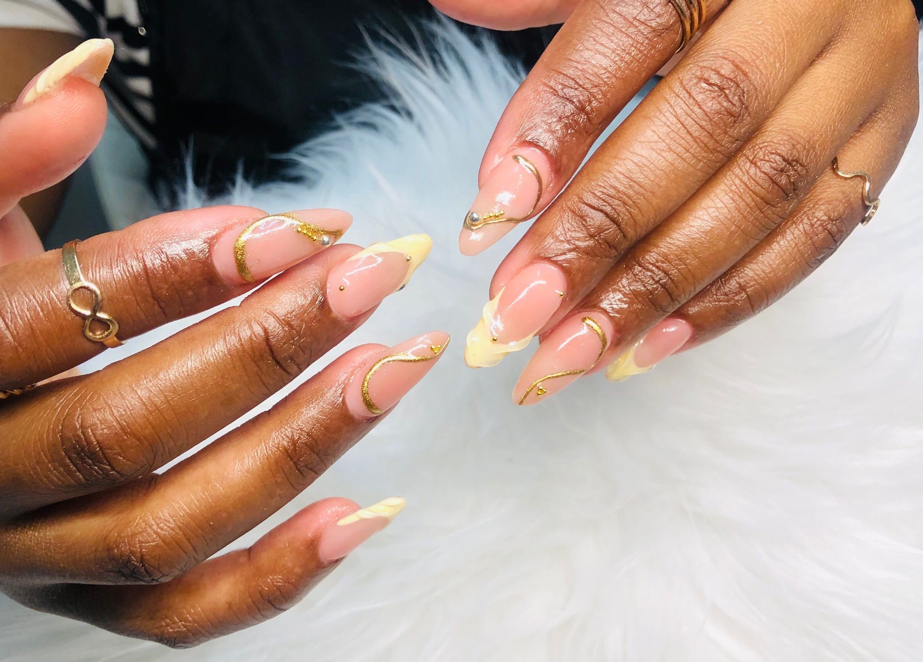 Elegant nail art with gold accents at Nailed by Mandy, Katlehong, Gauteng, ZA.