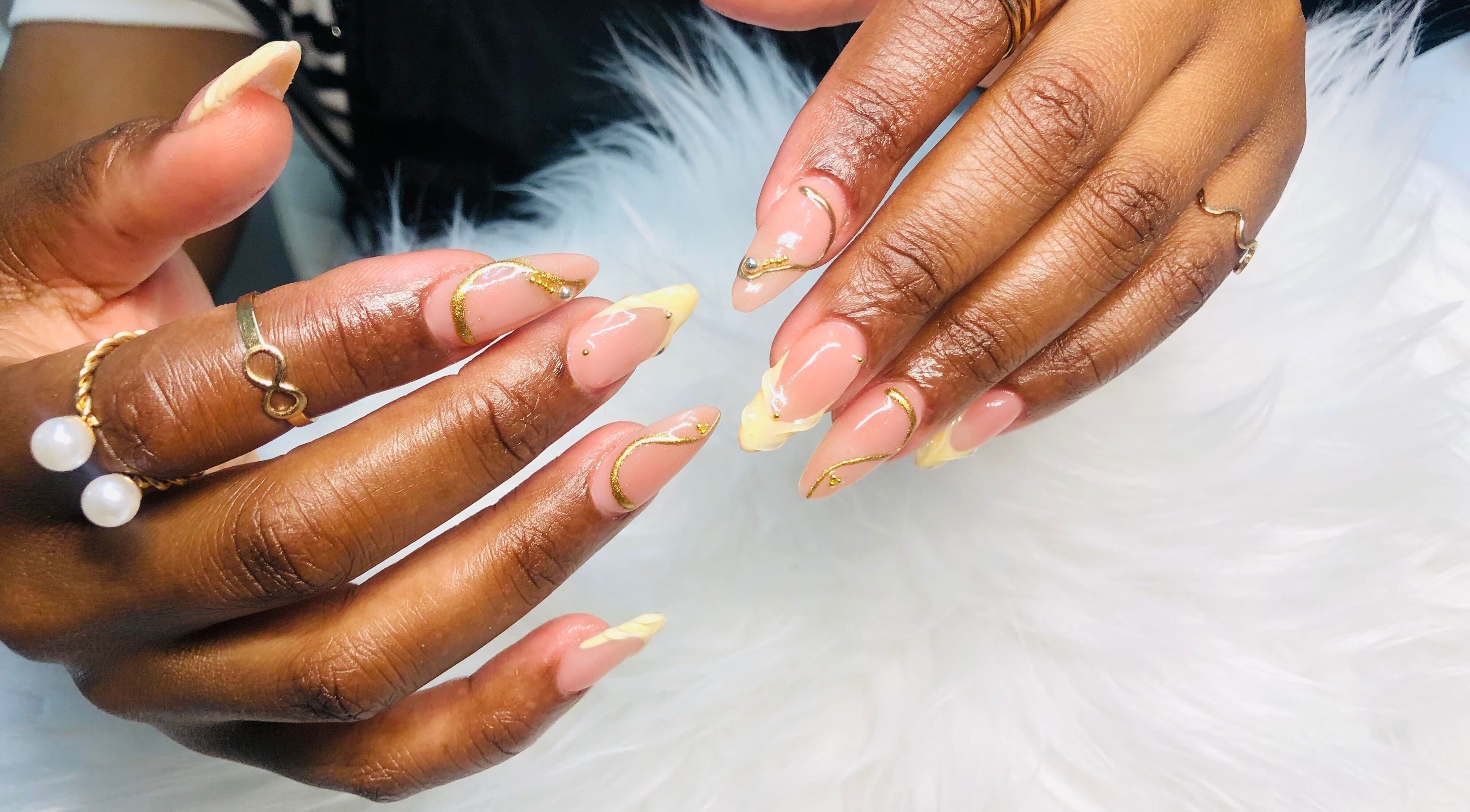 Elegant nail art with gold accents at Nailed by Mandy, Katlehong, Gauteng, ZA.