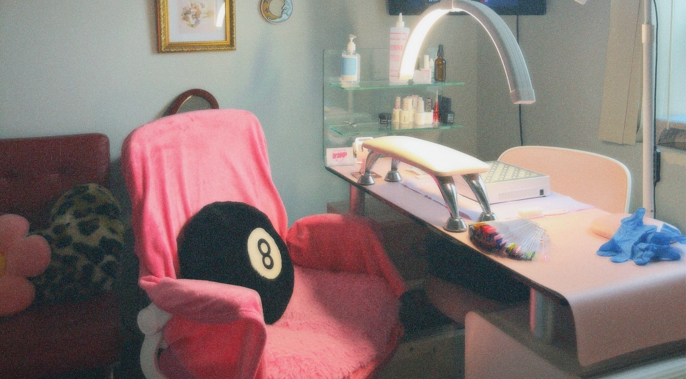 Cozy nail station at Thatyana’s Nail Place in St. Catharines, Ontario, CA, featuring plush seating and stylish decor.
