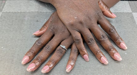 Beautifully manicured hands with soft pink nails at Starz & Knyvz Nails, Beaconsfield, England, GB.