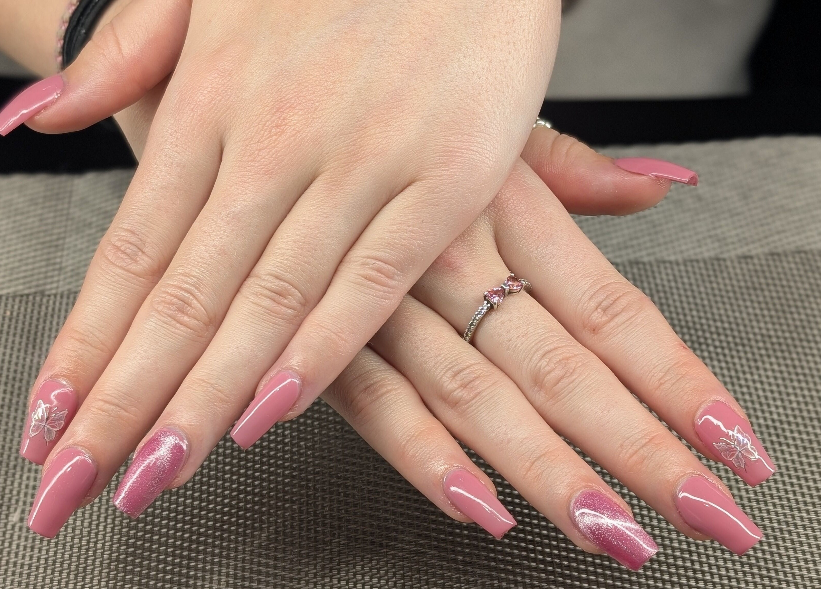 Elegant pink nail art at Starz & Knyvz Nails, Beaconsfield, England, GB showcases intricate floral design.