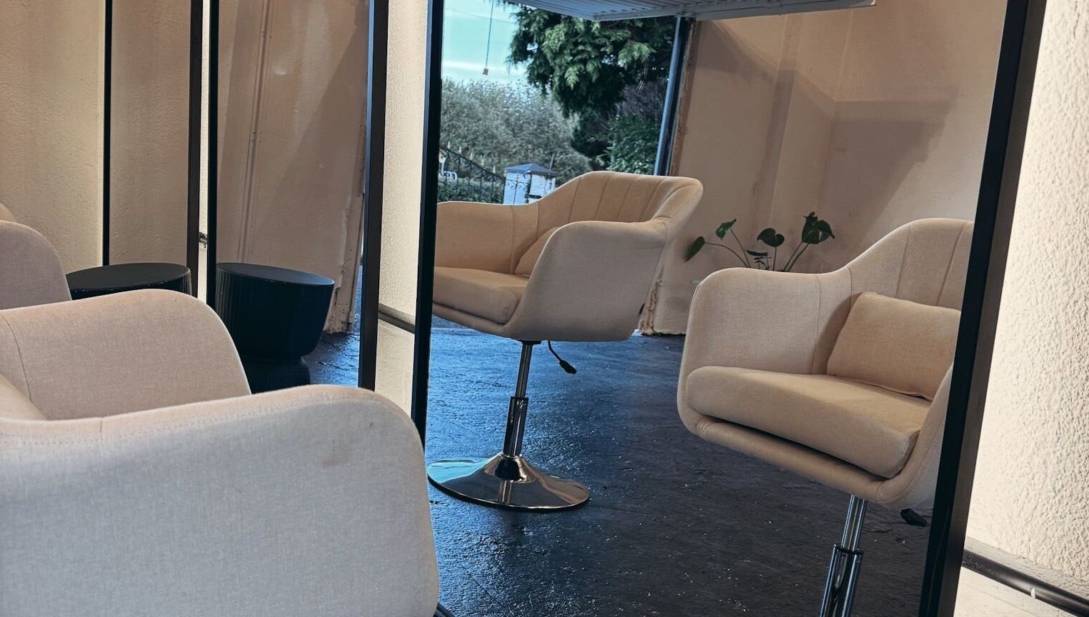 Modern beige salon chairs at Salon LOTI, Newry, Northern Ireland, GB creating a cozy, stylish setting.