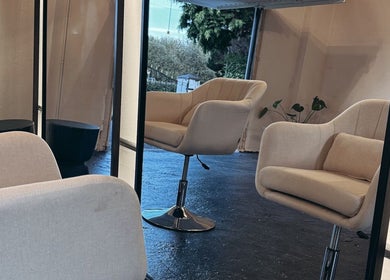 Modern beige salon chairs at Salon LOTI, Newry, Northern Ireland, GB creating a cozy, stylish setting.