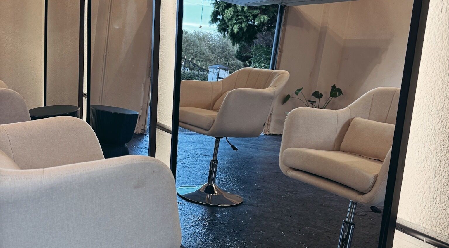 Modern beige salon chairs at Salon LOTI, Newry, Northern Ireland, GB creating a cozy, stylish setting.