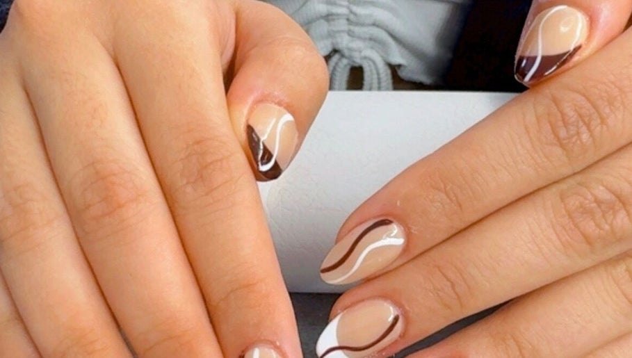 Chic nail art design at Nail by Alin, Clydebank, Scotland, GB, featuring brown and white abstract patterns.