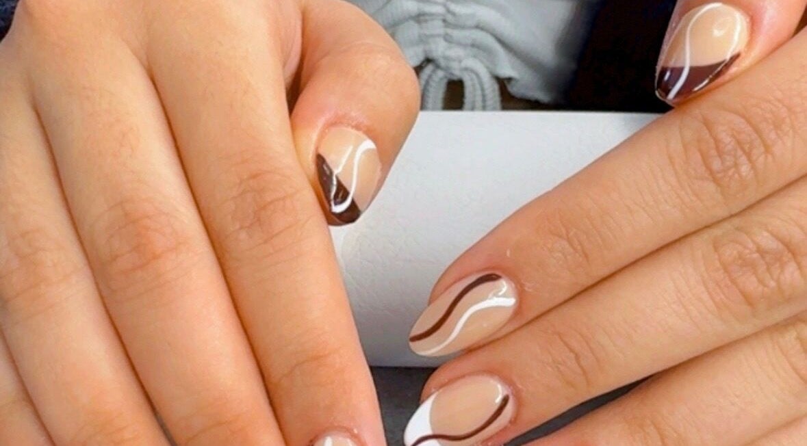 Chic nail art design at Nail by Alin, Clydebank, Scotland, GB, featuring brown and white abstract patterns.