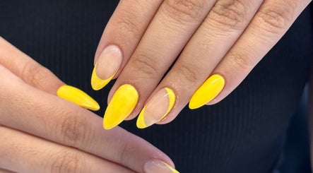 Bright yellow almond-shaped nails at Nail by Alin, Clydebank, Scotland, GB showcasing vibrant manicure.