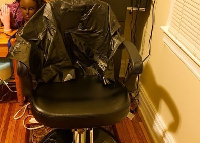 Styling chair at Lady Chic, Rochester, New York, US, with beauty tools, showcasing professional salon environment.