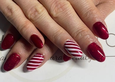 Stylish red and white striped nails at Bethan Beeston, Sandbach, England, GB, showcasing expert nail artistry.