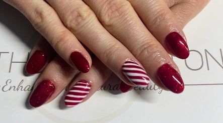 Stylish red and white striped nails at Bethan Beeston, Sandbach, England, GB, showcasing expert nail artistry.